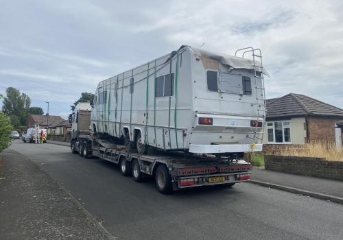 Unusual arkward job recovering a non running American camper with a tarpaulin for a roof from a housing estate on the outskirts 